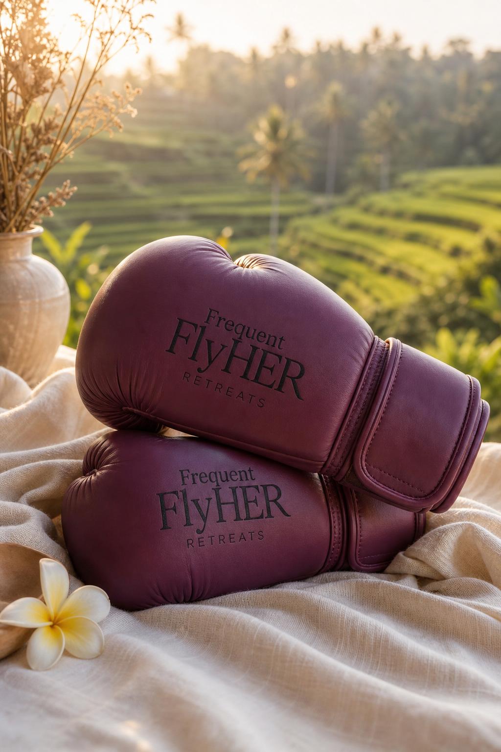 Pink boxing gloves on linen with Bali rice terraces